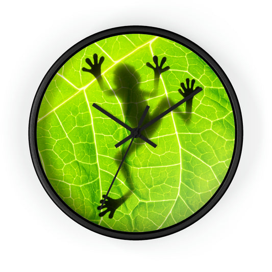 Silhouette of Frog with green leaf.  Wall Clock. Custom Artwork. Unique Whimsical Flare. Vivid Colors. Great to have in every room of your home and business. Looks Fabulous on the wall, definitely a splash of color! Such a wonderful Gift!